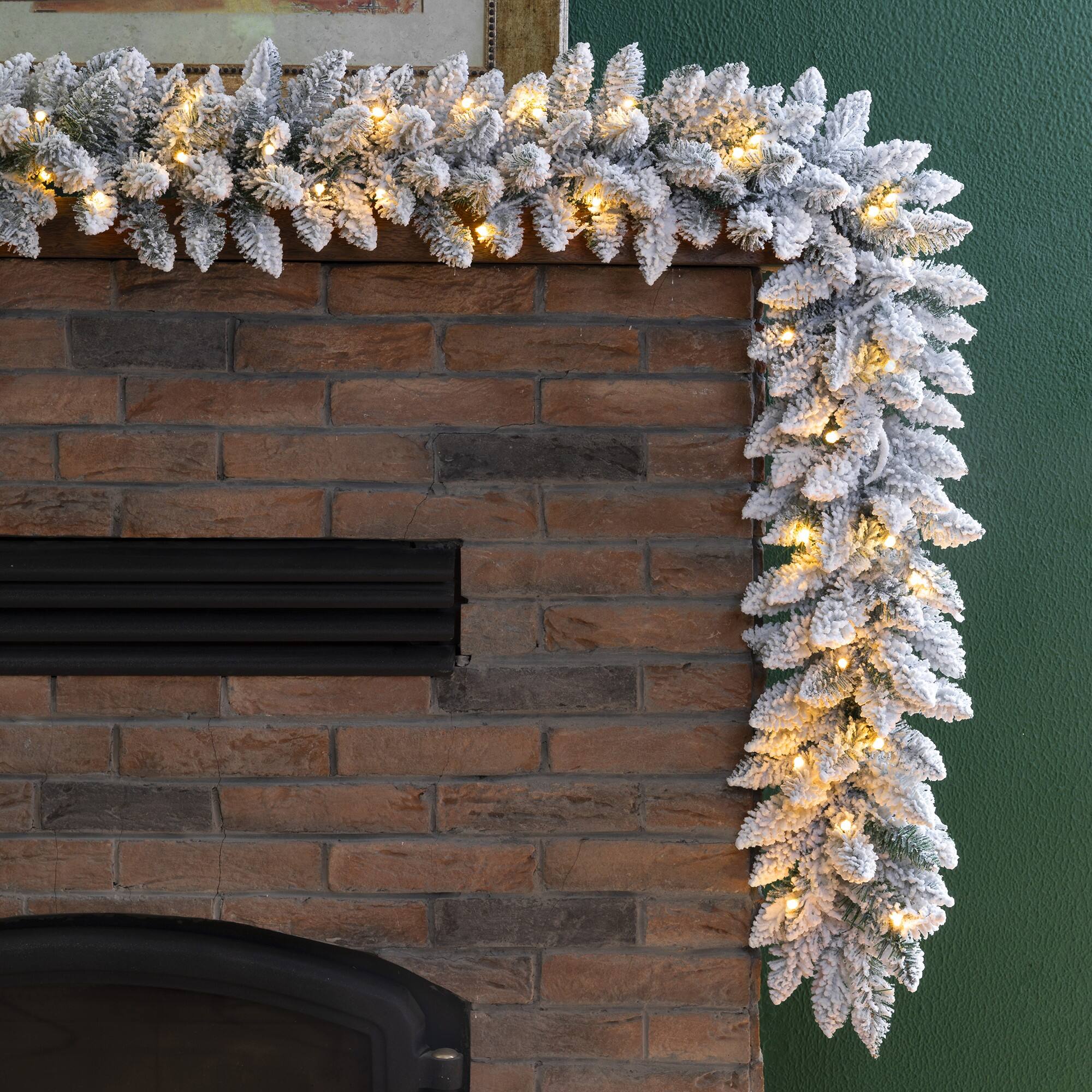 Glitzhome® 9ft. LED Snow Flocked Christmas Garland